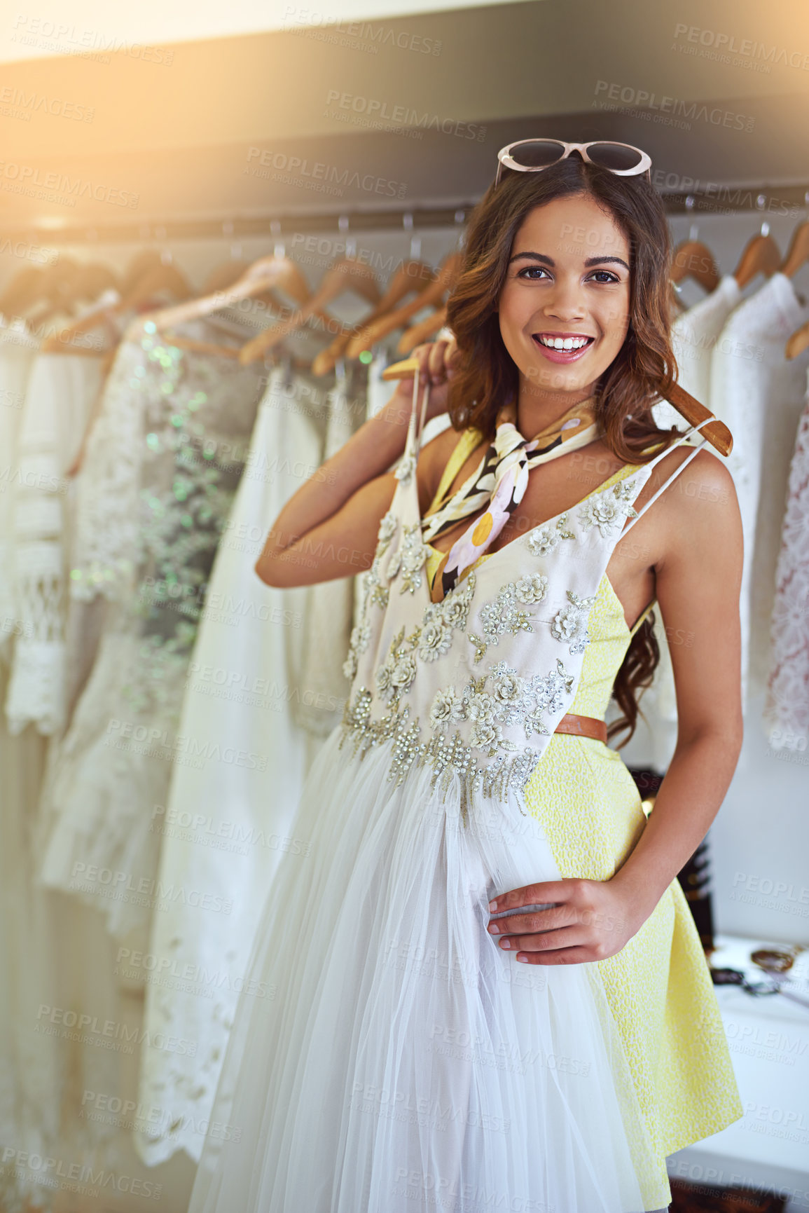 Buy stock photo Cropped shot of an attractive young woman searching for a wedding dress
