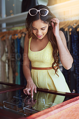 Buy stock photo Shot of an attractive young woman out shopping for accessories