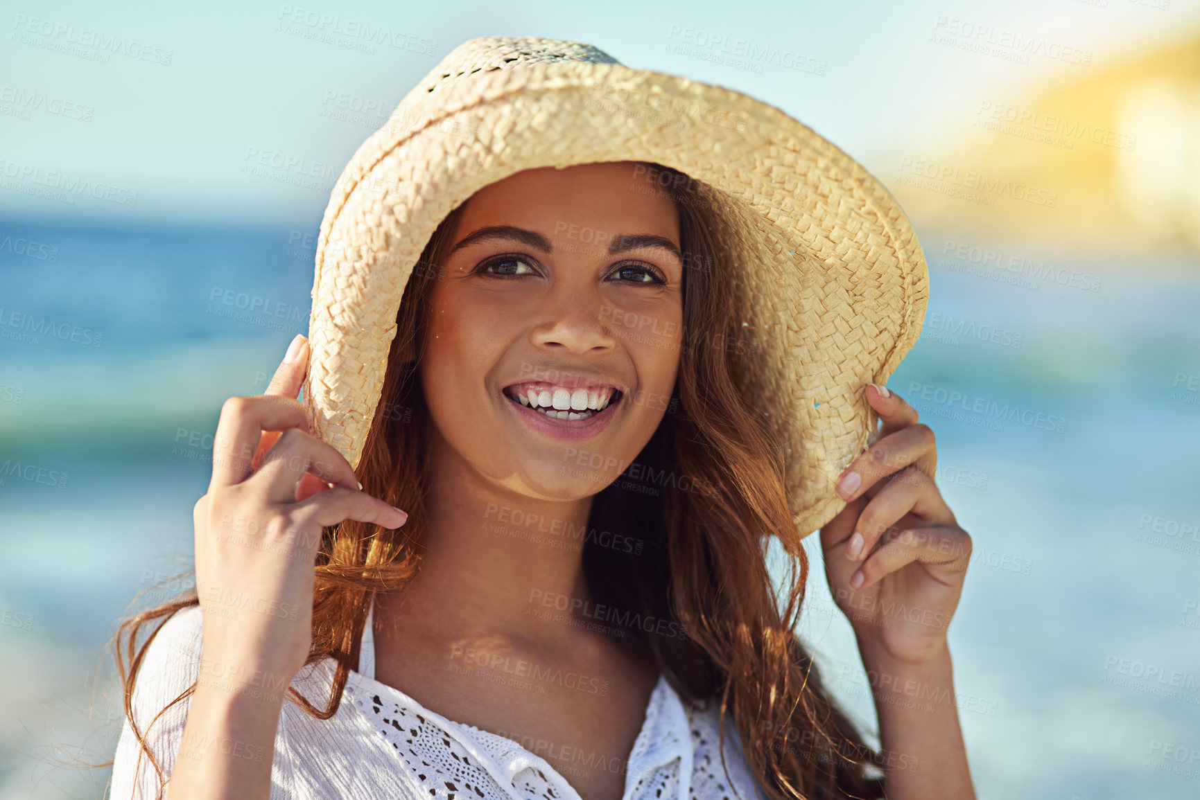 Buy stock photo Woman, beach and relax in portrait on vacation for wellness, happiness for freedom in Mauritius. Female person, smile and hat on head for sun protection by ocean, island adventure or holiday travel