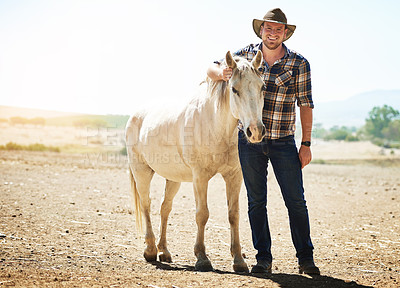 Buy stock photo Portrait, farmer and man with horse, sunshine and nature with happiness, equestrian and smile. Summer, person and outdoor with guy, animal or cowboy with stallion, countryside or pet with environment