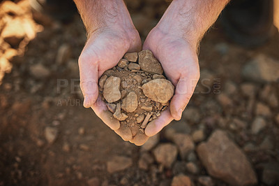 Buy stock photo Cropped shot of a farmer holding soil