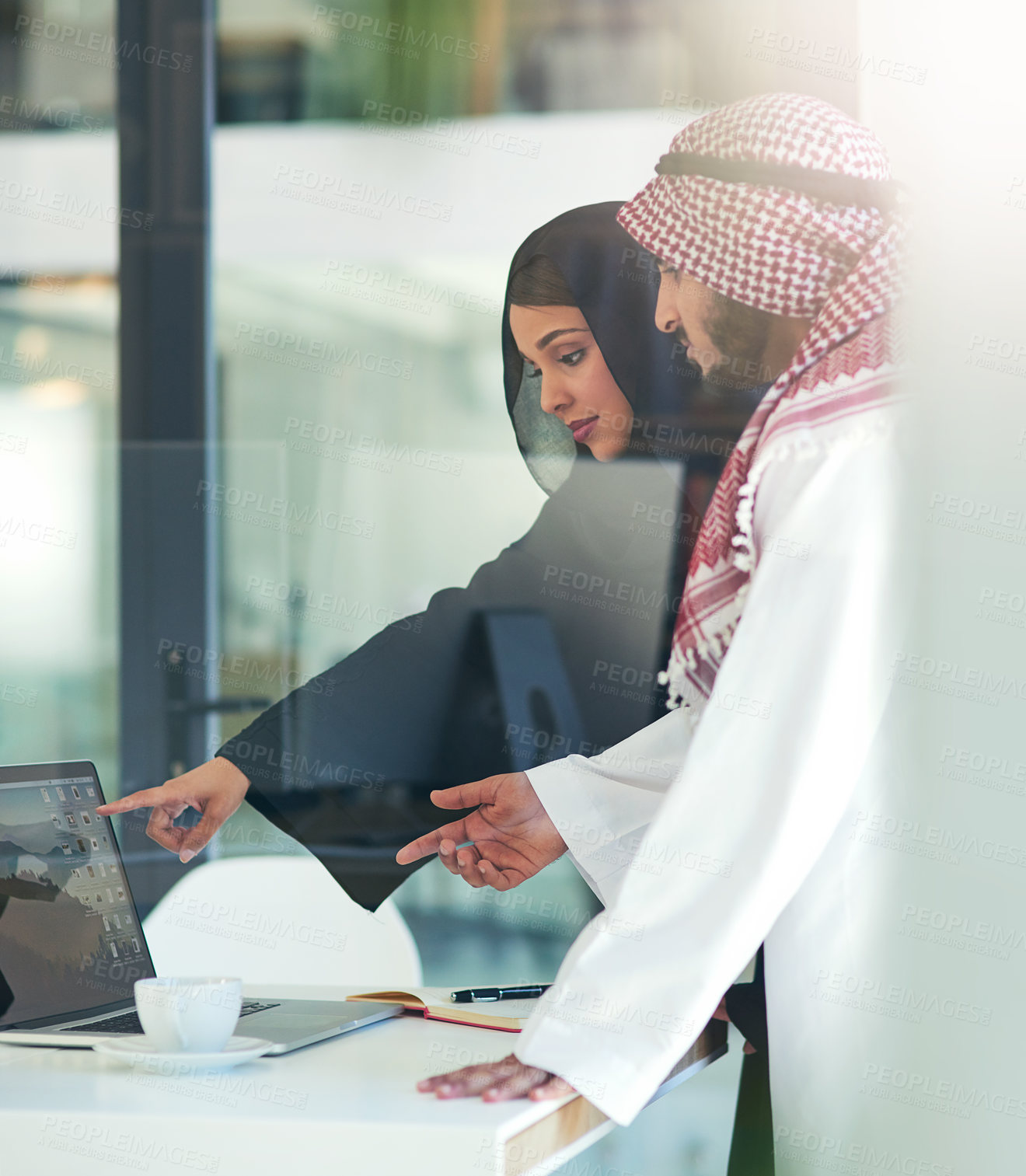 Buy stock photo Business people, Arabic and pointing at laptop screen in office for consult, advice or client. Lens flare, hijab woman and man with keffiyeh for asset management, planning or idea at Investment bank
