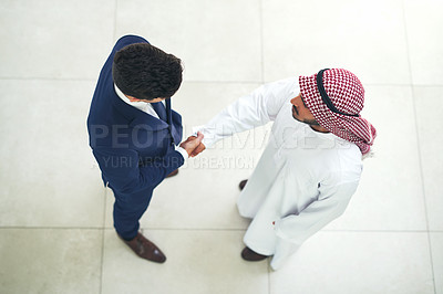Buy stock photo Arab, business and people with handshake in workplace, recruitment and muslim employee for greeting. B2b partnership, collaboration and congratulation gesture for deal, islam company and onboarding