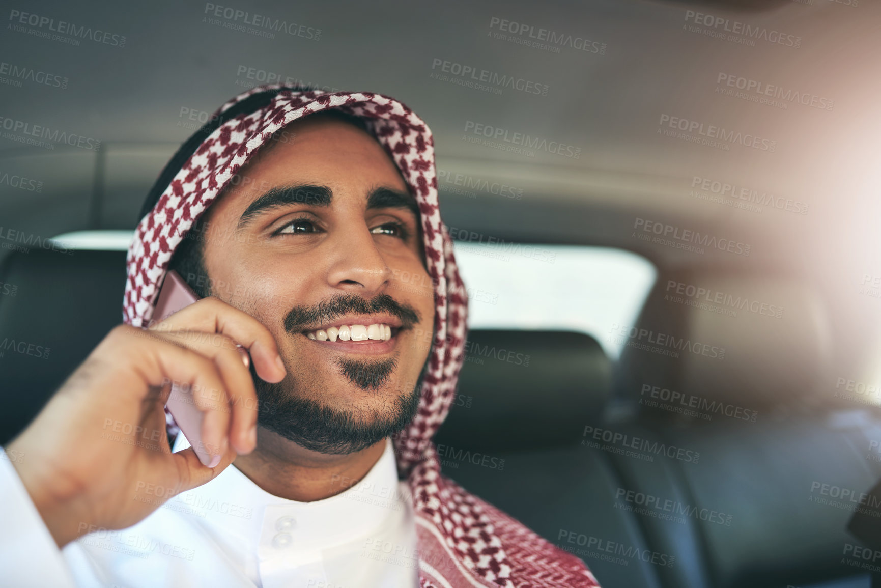 Buy stock photo Muslim man, talking and phone call in taxi for travel, journey or commute to work in transport. Islam, car and happy passenger on mobile for business deal, schedule or listen to news in Saudi Arabia