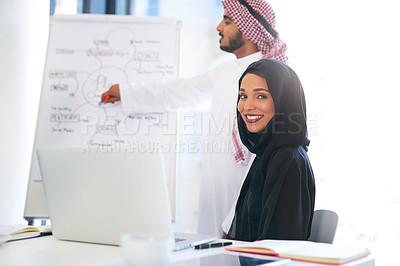Buy stock photo Portrait of a young muslim businesswoman sitting in on a presentation with her colleague at work