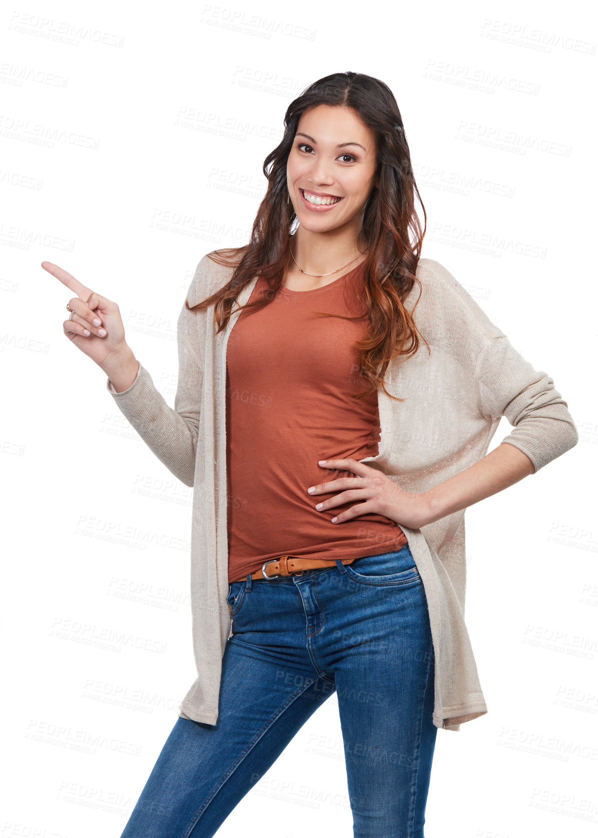 Buy stock photo Portrait of a confident young woman pointing at blank copyspace in studio