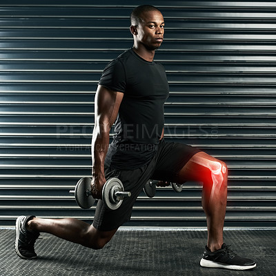 Buy stock photo Full length portrait of an athletic young man working out with dumbbells in the studio