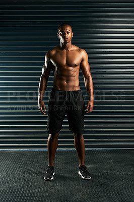 Buy stock photo Full length portrait of an athletic young man posing shirtless in the studio