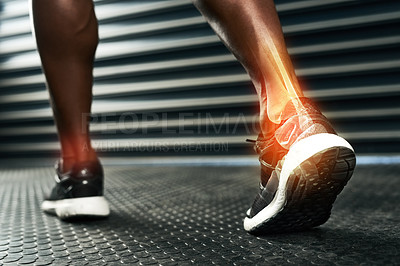 Buy stock photo Rearview shot of an unrecognizable man's ankle during a workout