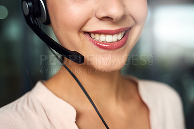 Buy stock photo Cropped shot of a young call centre agent working in an office