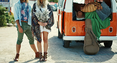 Buy stock photo Cropped shot of young hipster couple standing outside next to a camper van