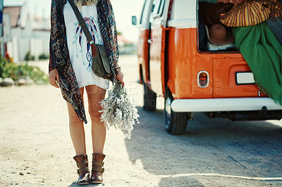 Buy stock photo Cropped shot of young woman standing outside next to a camper van