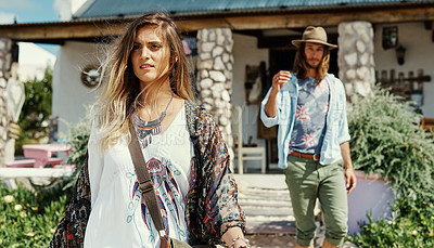 Buy stock photo Shot of a young hipster couple walking out of a cafe