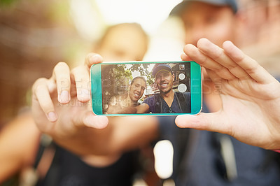 Buy stock photo Shot of two young friends taking a selfie while traveling together in Thailand