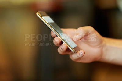 Buy stock photo Cropped closeup shot of a man using a mobile phone