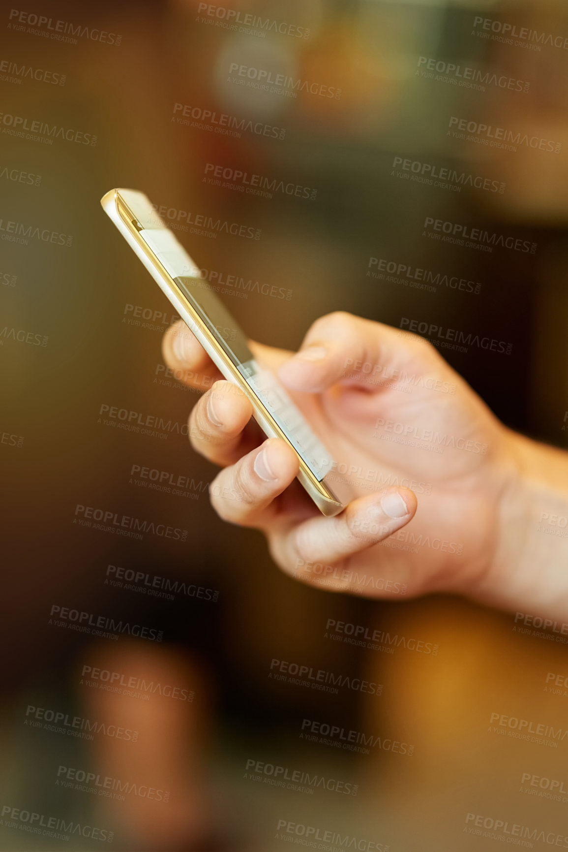 Buy stock photo Cropped closeup shot of a man using a mobile phone