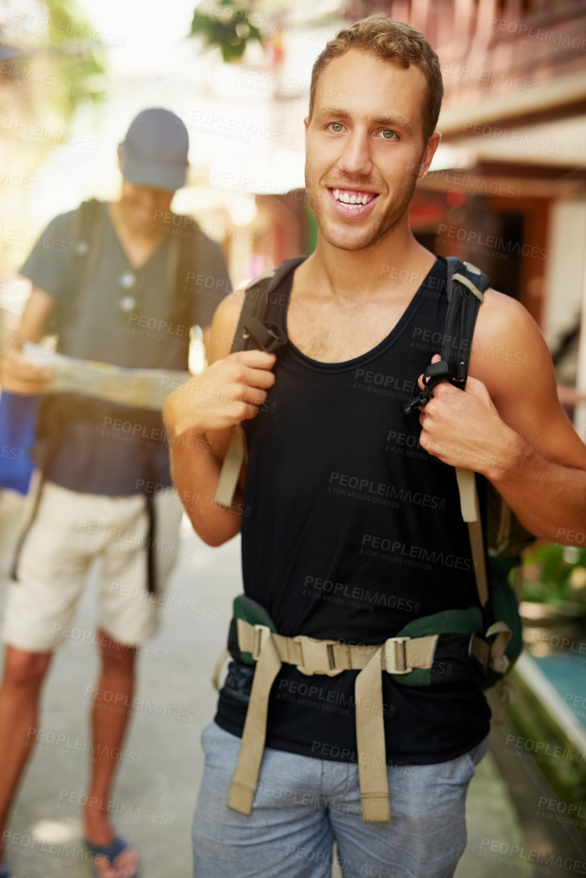 Buy stock photo Portrait of two smiling young friends wearing backpacks traveling together in Thailand
