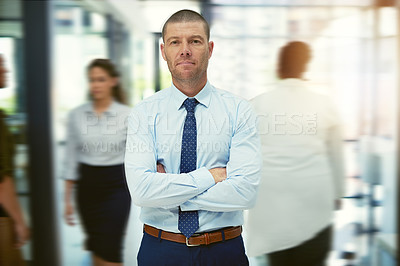 Buy stock photo Portrait of a mature businessman standing in a busy office