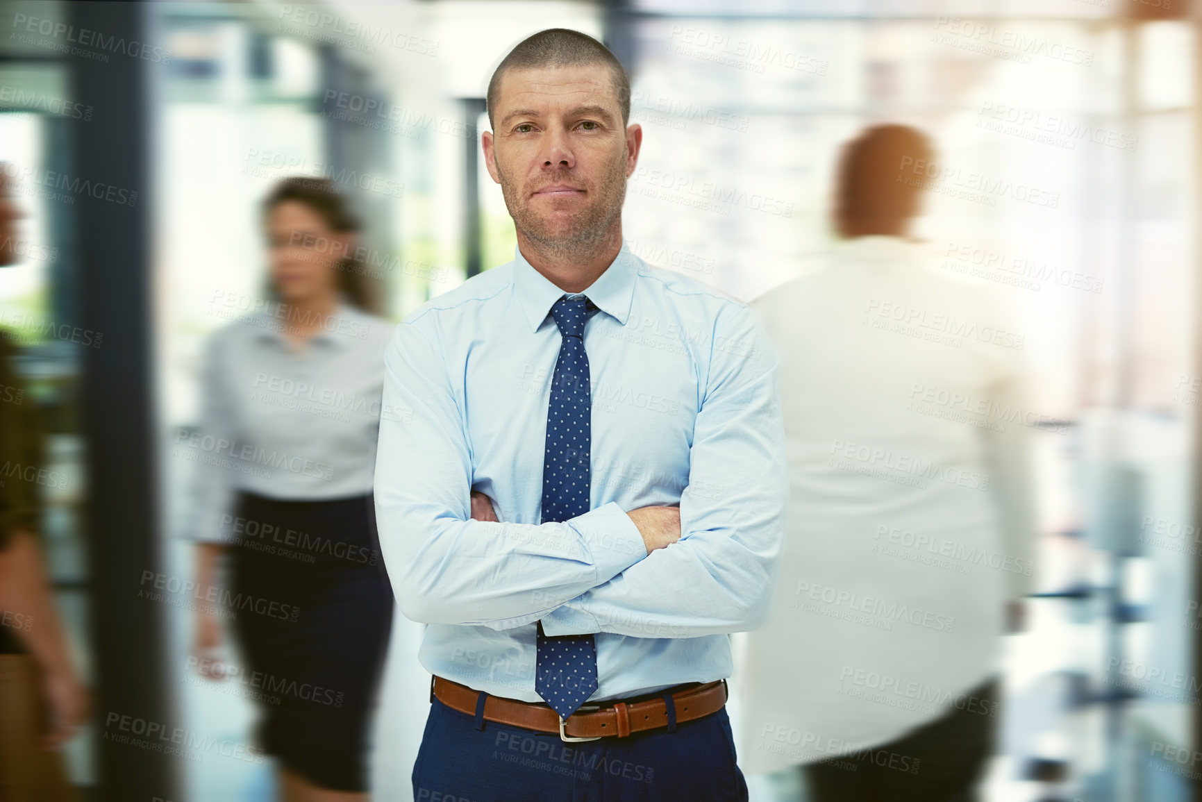 Buy stock photo Portrait of a mature businessman standing in a busy office