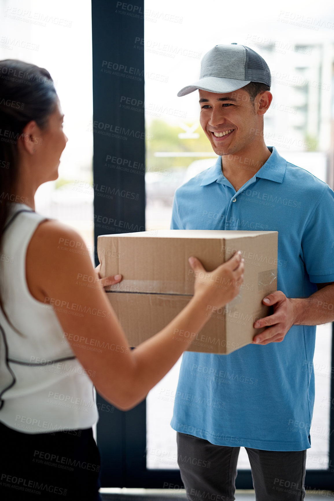 Buy stock photo Cropped shot of a courier making a delivery to a businesswoman at her office