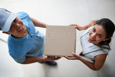 Buy stock photo Portrait of a courier making a delivery to a businesswoman at her office