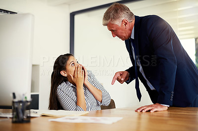 Buy stock photo Cropped shot of a businessman reprimanding an employee in an office