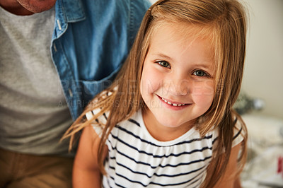 Buy stock photo Portrait of a smiling little girl sitting with her father at home
