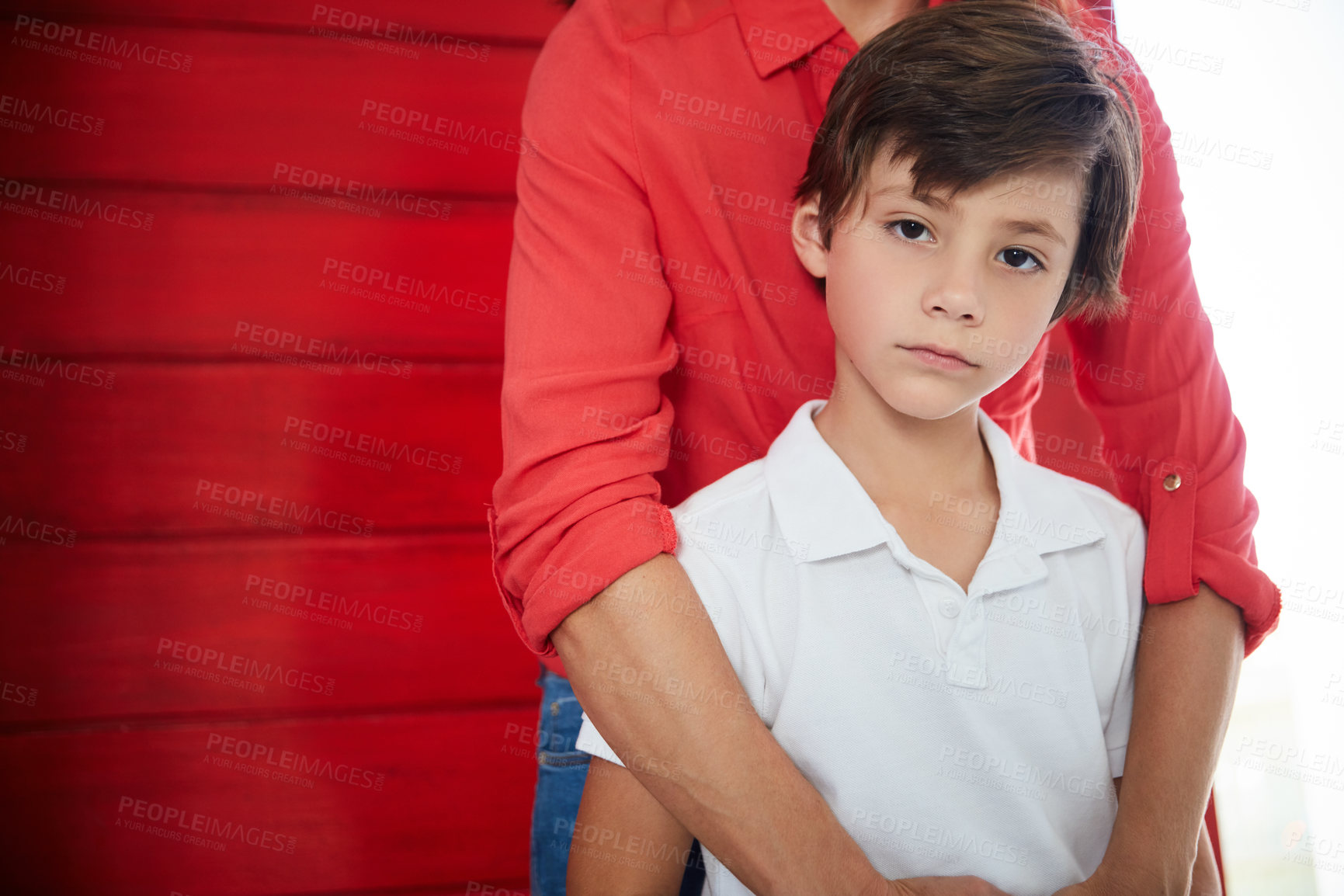 Buy stock photo Portrait of a sad little boy being comforted by his mother at home