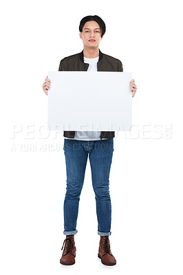 Buy stock photo Sign, portrait and man with poster for mockup, marketing or advertising space in studio isolated on a white background. Product placement, branding and young male with banner for mock up or promotion