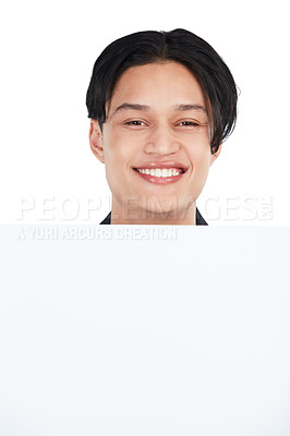 Buy stock photo Face, portrait and man with poster for mockup, marketing or advertising space in studio isolated on a white background. Product placement, branding and happy male with banner for mock up or promotion