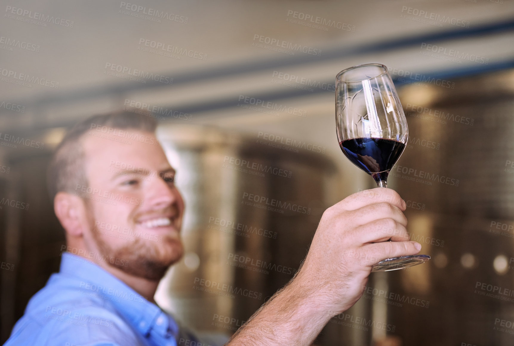 Buy stock photo Cropped shot of a man enjoying wine tasting in his distillery