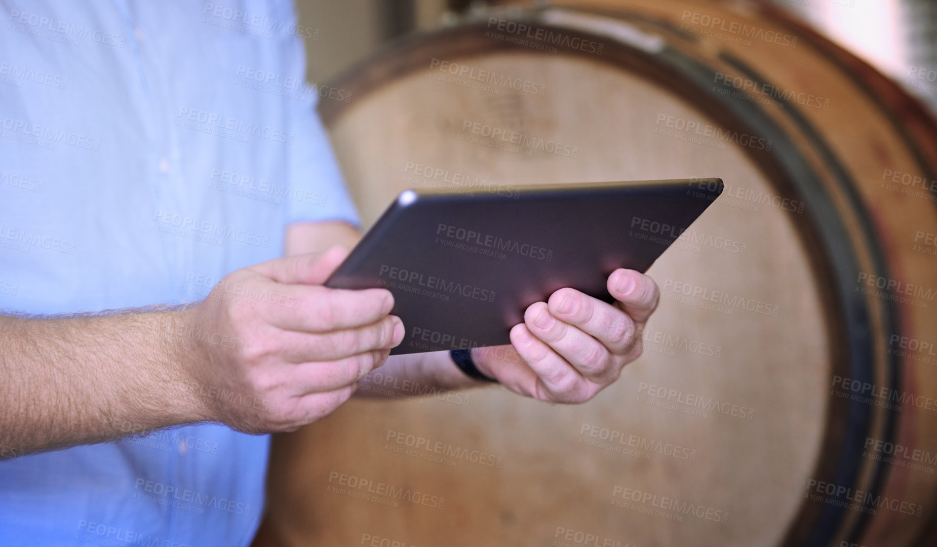 Buy stock photo Hands, man and working with tablet in brewery, inventory check and manufacturing for beer production with tech. Factory, manager or connection with digital for research, barrel or business management