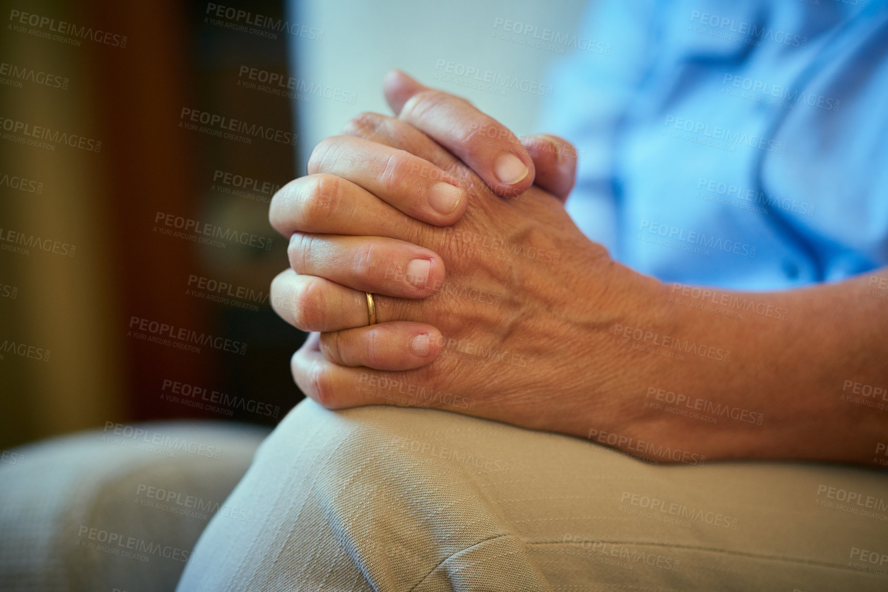 Buy stock photo Closeup shot of a senior woman with her hands clasped together