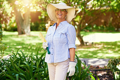 Buy stock photo Portrait of a happy senior woman enjoying a bit of gardening
