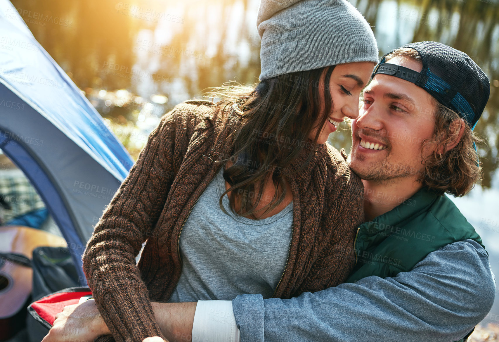 Buy stock photo Shot of a loving couple on a camping trip