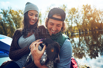 Buy stock photo Shot of a loving couple on a camping trip
