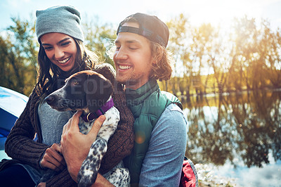 Buy stock photo Shot of a loving couple on a camping trip
