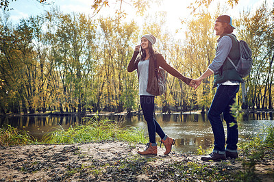 Buy stock photo Full length shot of an affectionate young couple spending a day in nature