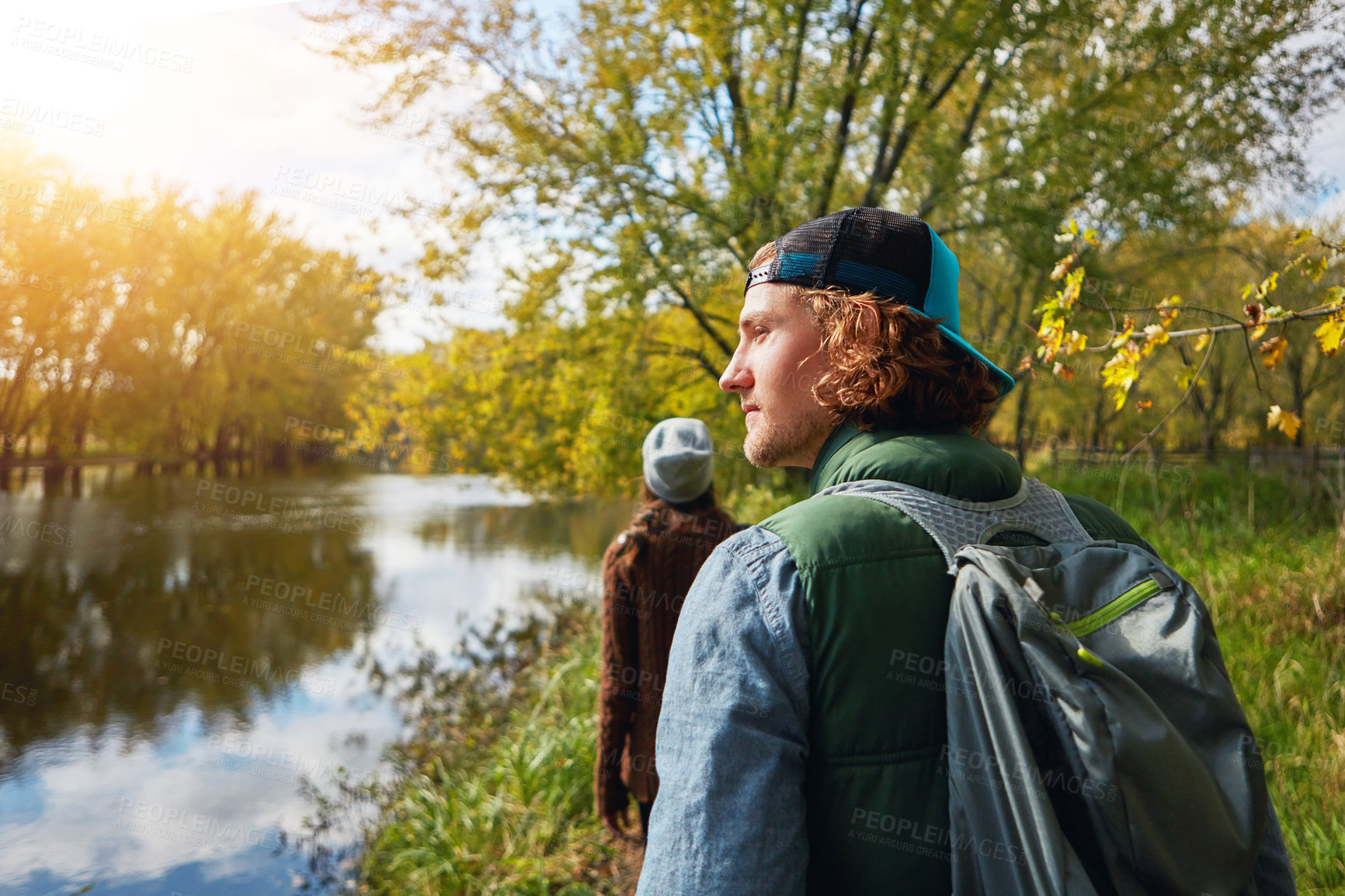 Buy stock photo Cropped shot of an affectionate young couple spending a day in nature