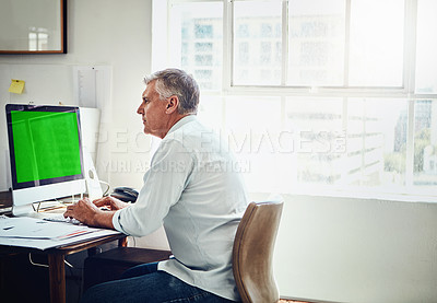 Buy stock photo Cropped shot of a mature businessman working in his office