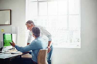 Buy stock photo Cropped shot of a mature businessman getting assistance from a colleague in the office