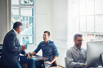 Buy stock photo Business people, office and talk with happy boss for team building with humor or joke for laugh. Technology, manager and positive work environment with designers in studio for employees in Sweden.