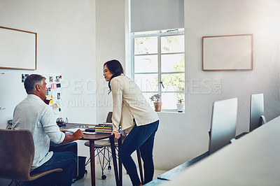 Buy stock photo Office, teamwork and business people by desk talking in modern workplace. Planning, collaboration and female employee discussing sales, advertising or marketing strategy with senior boss in company.