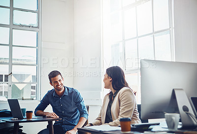 Buy stock photo Shot of colleagues having a discussion in a modern office