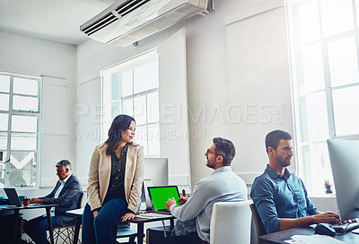 Buy stock photo Laptop green screen, teamwork and business people in office talking, discussion or conversation. Collaboration, mock up and employees, man and woman planning marketing, advertising or sales project.