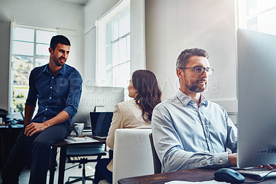 Buy stock photo Teamwork, office and business people at desk working on planning, marketing strategy and writing email. Corporate agency, startup and staff focus sitting at table, in meeting and coworking on ideas