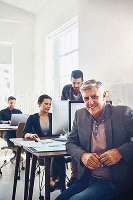 Buy stock photo Business, senior and portrait of man in office or company workplace. Leadership, ceo or happy elderly male employee or manager with coworkers working on marketing report, advertising or sales project