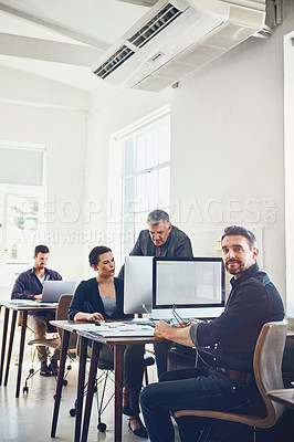 Buy stock photo Mature, portrait and business man by computer in office workplace. Leadership, manager or confident male employee working on marketing report, advertising or sales project with colleagues in company.