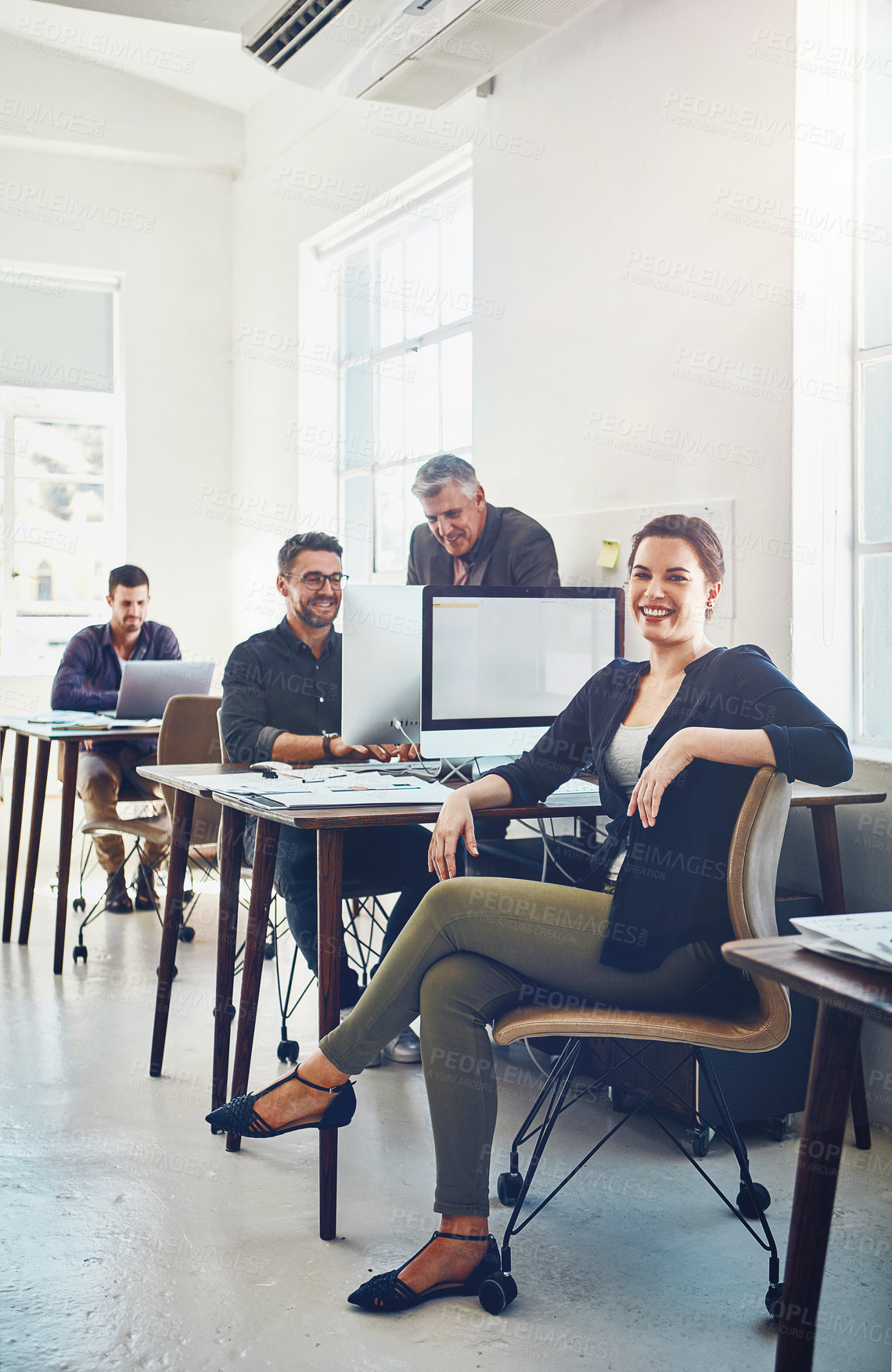 Buy stock photo Teamwork, portrait and business woman in office workplace ready for targets or goals. Leadership, ceo and happy female manager sitting on chair with coworkers working on sales or advertising project.