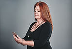 Monitoring personal and business activities all from her smart phone